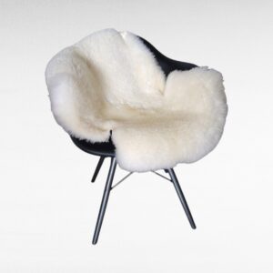 Natural Cream + White Sheepskin fur Rug on Chair used as a throw
