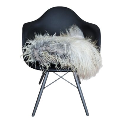 Light gray icelandic curly sheepskin throw on chair