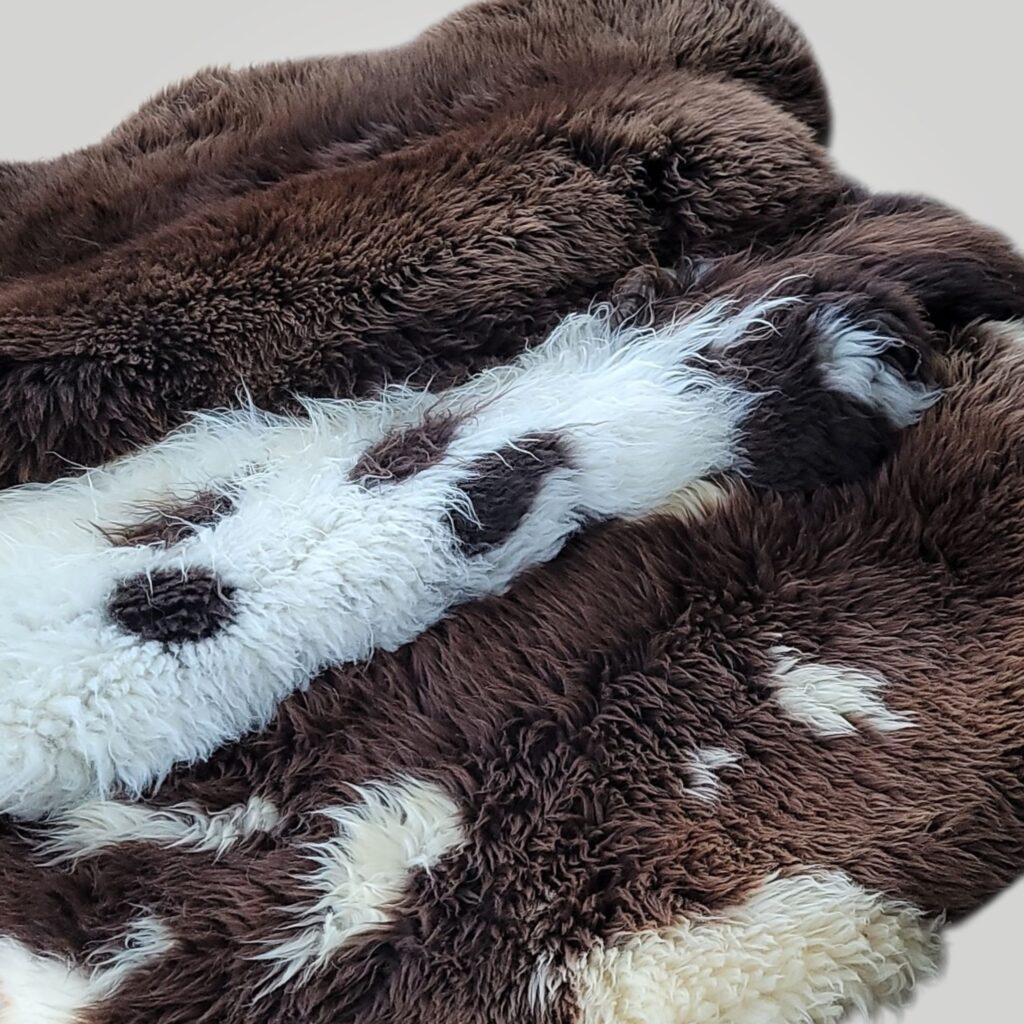Big Dense Holland sheepskins layered on the floor to show you their thick wool pile. They make the ultimate fluffy rug!