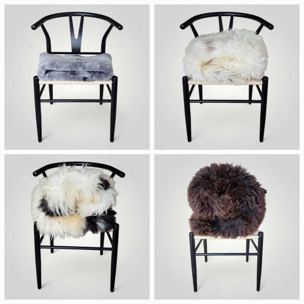 4 sheepskins rolled in balls on a chair to show you the loftiness difference of each sheepskin