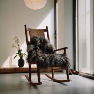 Cozy rocking chair with gray Icelandic sheepskin being used as a throw over the seating surface to add style, texture and comfort.