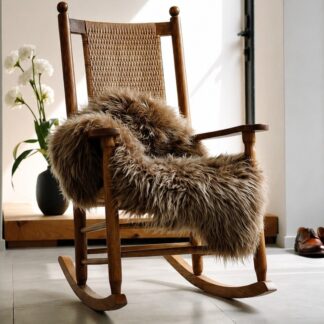 Icelandic sheepskin rug light golden brown color shown in rocking chair to soften seat