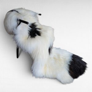Spotted double pelt rug made using 2 100% genuine Icelandic sheepskin pelts displayed in a modern chair