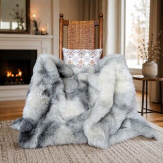 Rare natural gray wool sheepskin throw blanket shown in a rocking chair