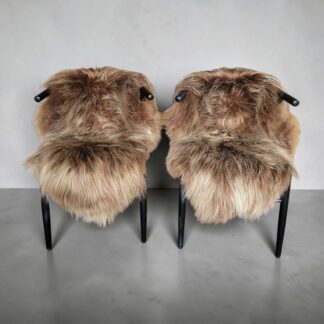 hand-picked set of two light brown sheepskins displayed on chairs