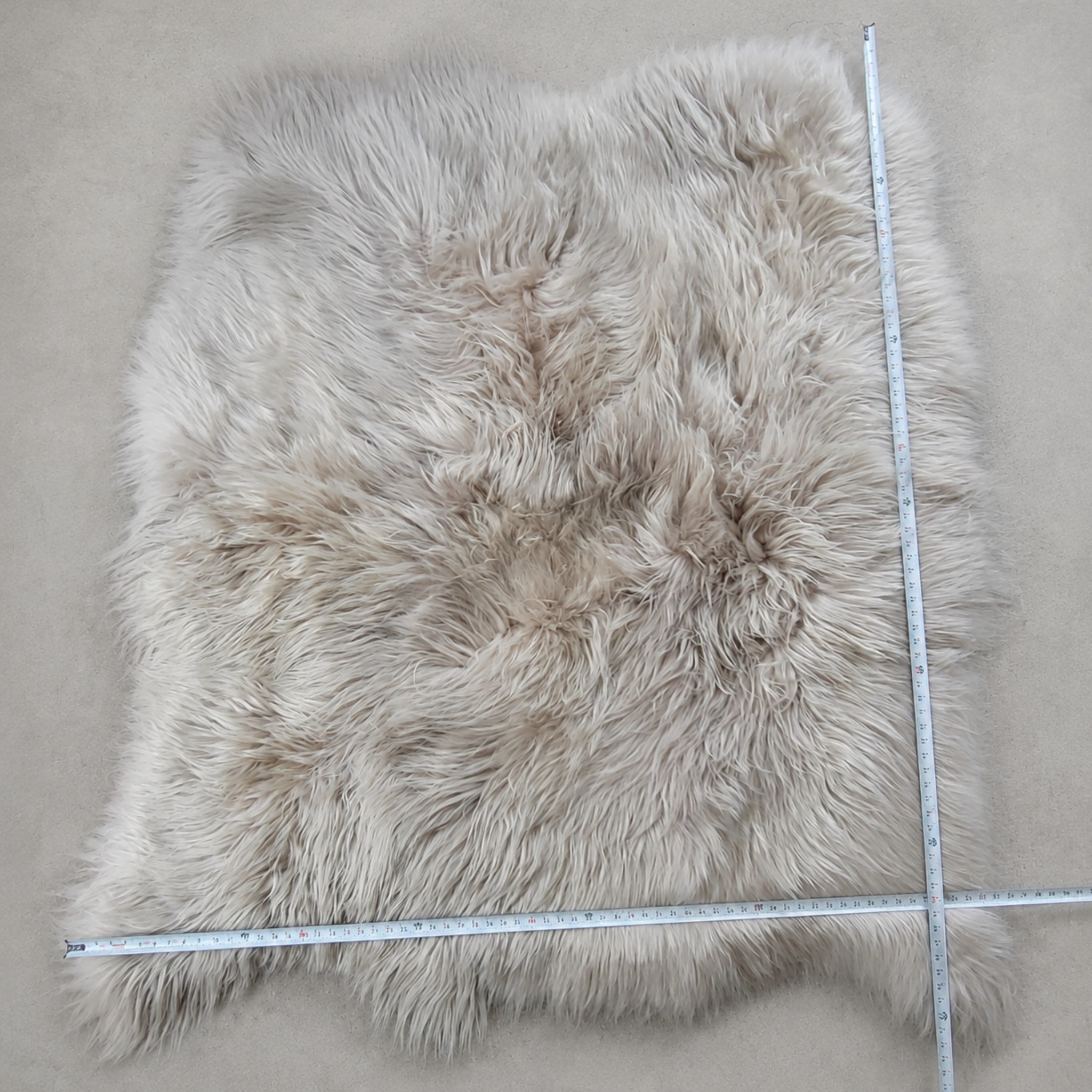 Picture showing how we measure our natural shape sheepskin area rugs